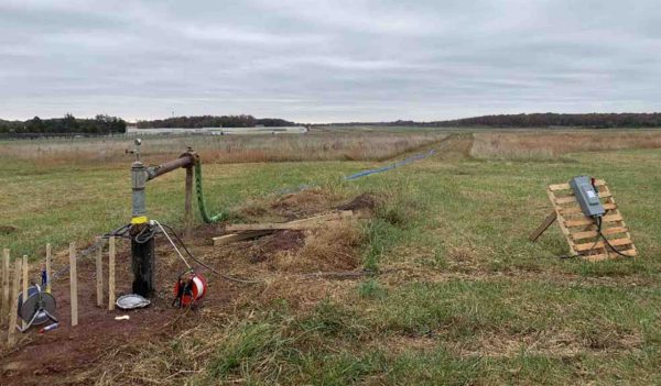 Groundwater supply testing in an open field.